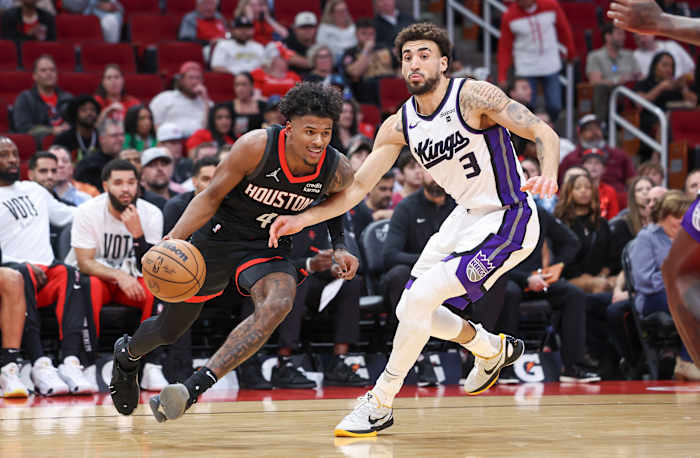 Rockets guard Jalen Green drives with the ball as Sacramento Kings guard Chris Duarte (3) defends during the first quarter at Toyota Center.